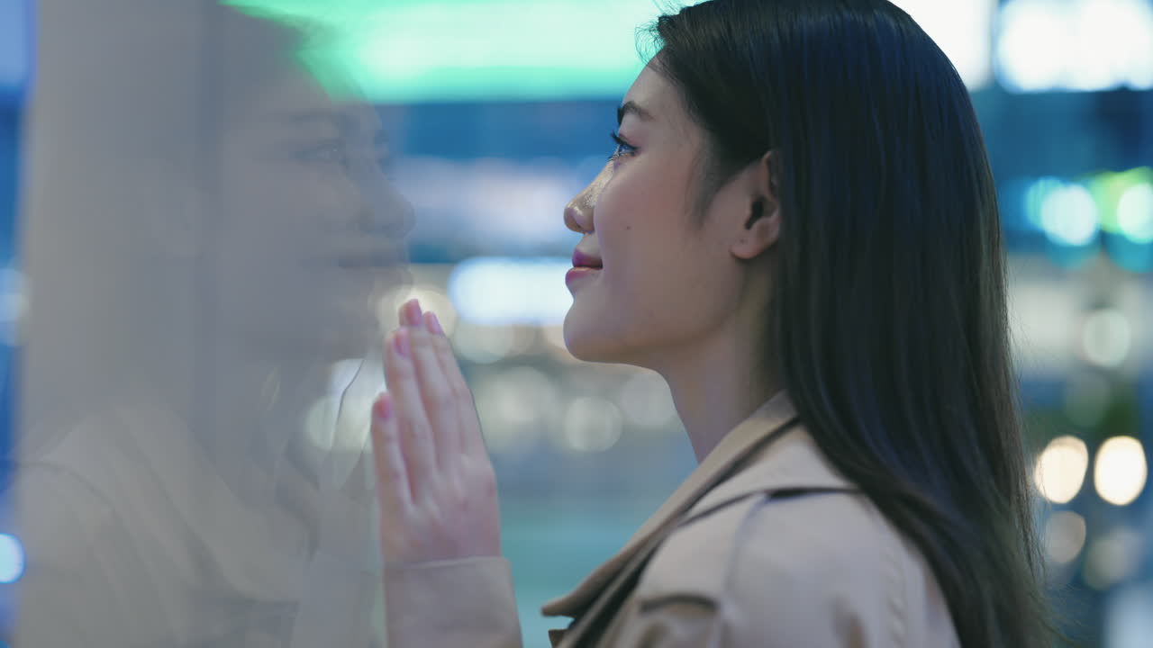 Blurred City Night Scene with Woman Reflection