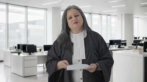 happy indian senior female lawyer fighting the case