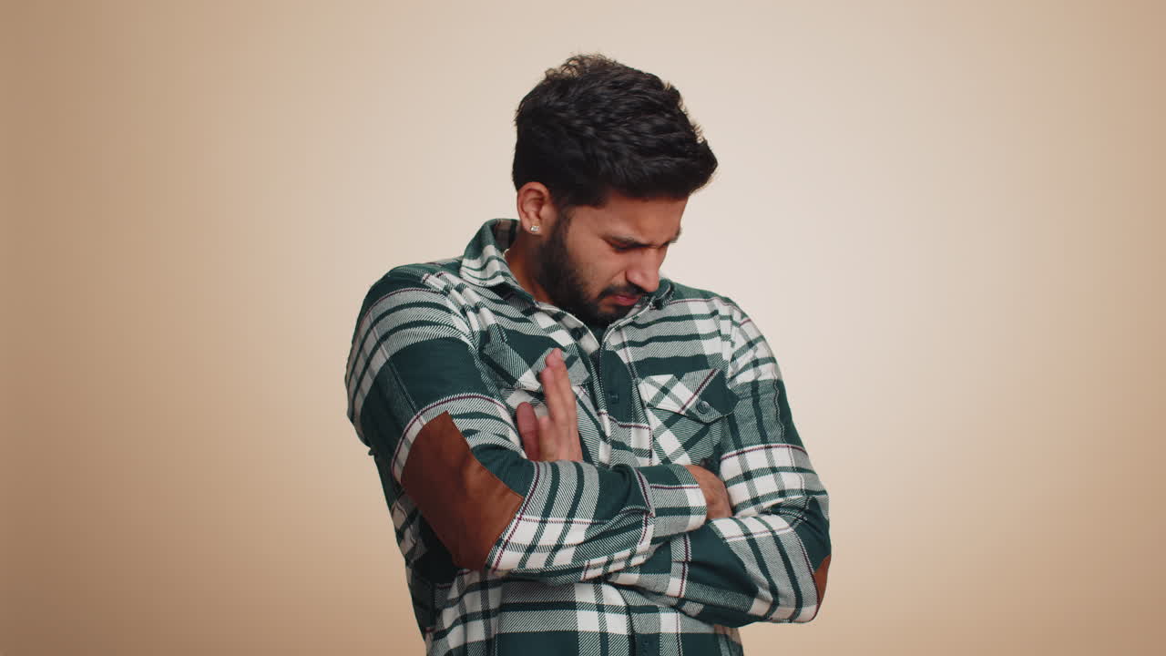 Offended sad indian man having frustrated after quarrel fail lose ignores does not want to talk