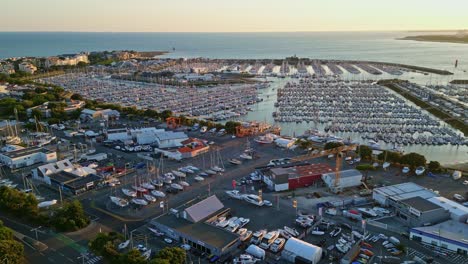forward panoramic drone movement to the port des minimes of la rochelle main harbor site on sunset, charente-maritime, france