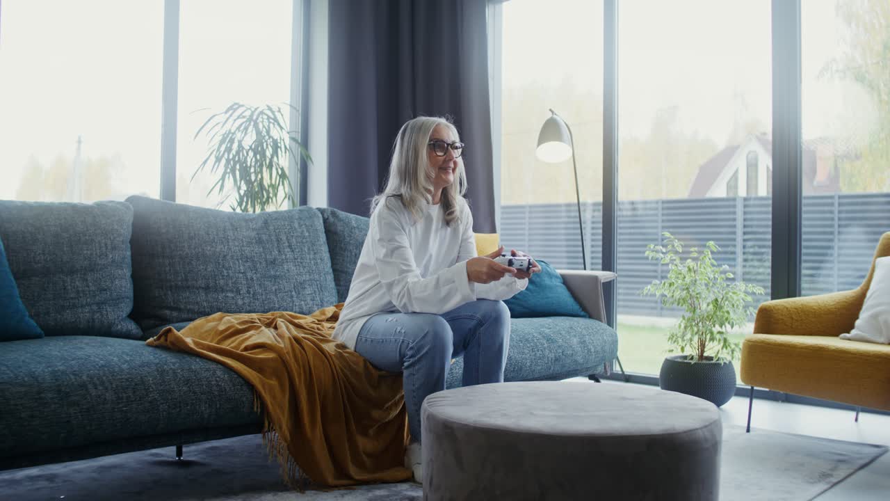 A woman playing video games in her living room