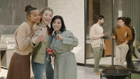 a beautiful  group of three girls take a selfie