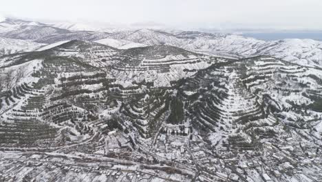 snowy mountain landscape with terraced farms