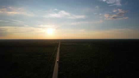 drone shot of sunset with road in yucatan mexico