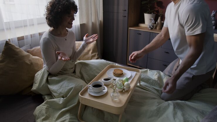 Couple enjoying a breakfast in bed