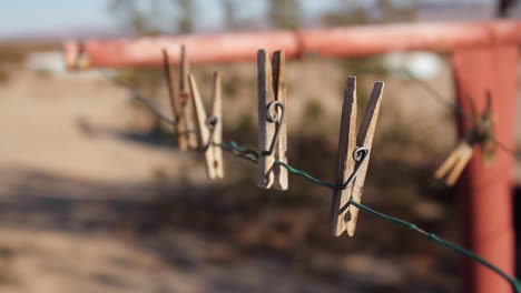 clothes pins moving on laundry line in desert joshua tree