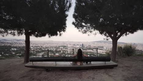 latino spending time alone in solace viewing barcelona spain