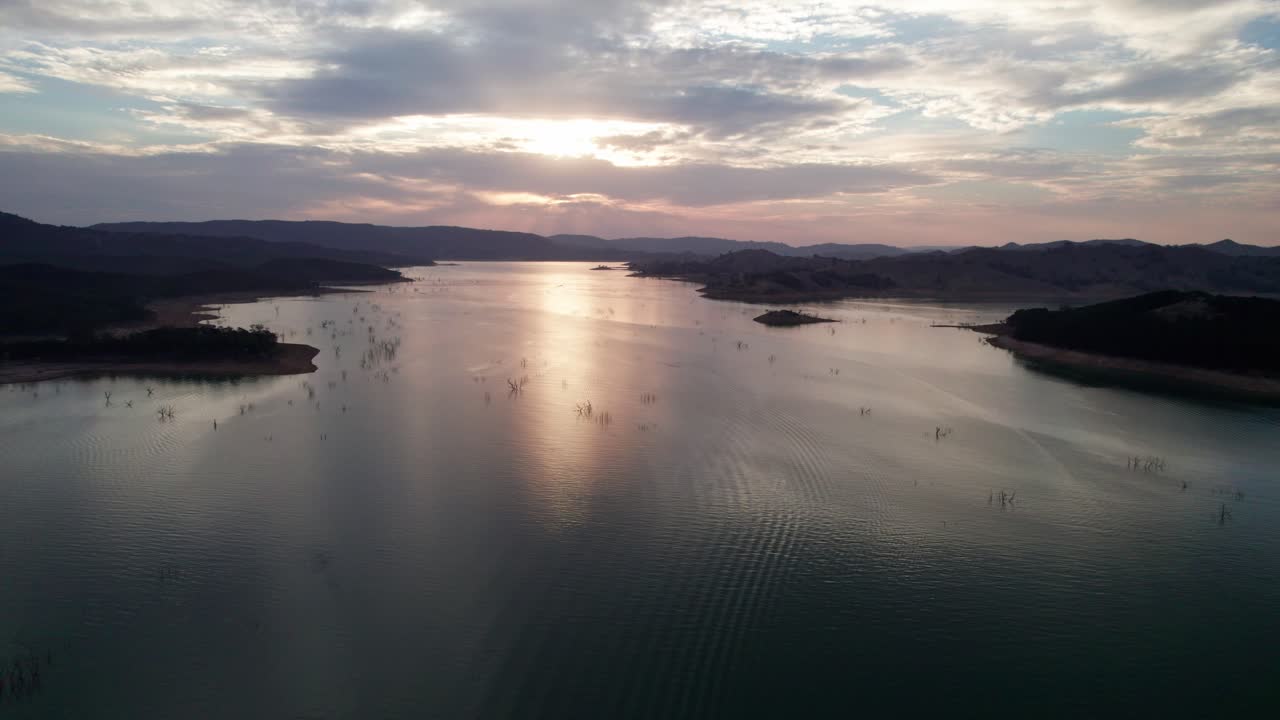 Aerial footage of a sunset over Lake Eildon, near Mansfield in central Victoria, Australia. The storage was 61% full. April 2025.