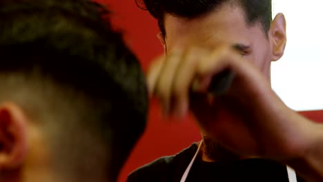 man getting his hair cut by hairdresser 4k