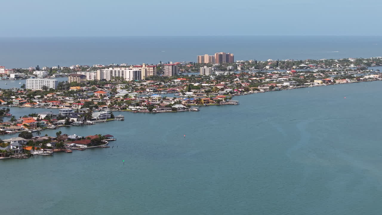 Aerial view panning in front of the Island Estates, sunny day in Florida, USA