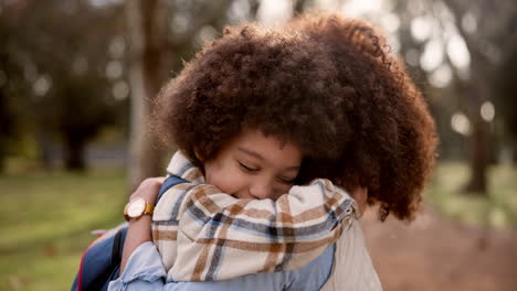 a mother and child sharing a loving hug outdoors