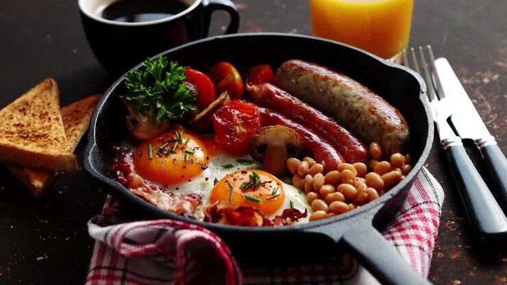 Full English breakfast on dark rusty background