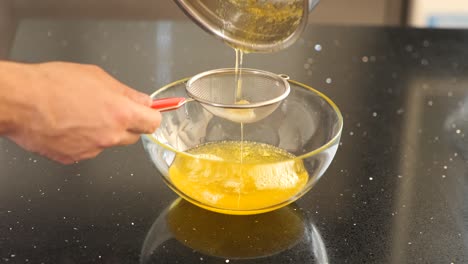 Straining-boiled-butter-for-cooking