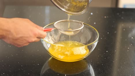 straining boiled butter for cooking