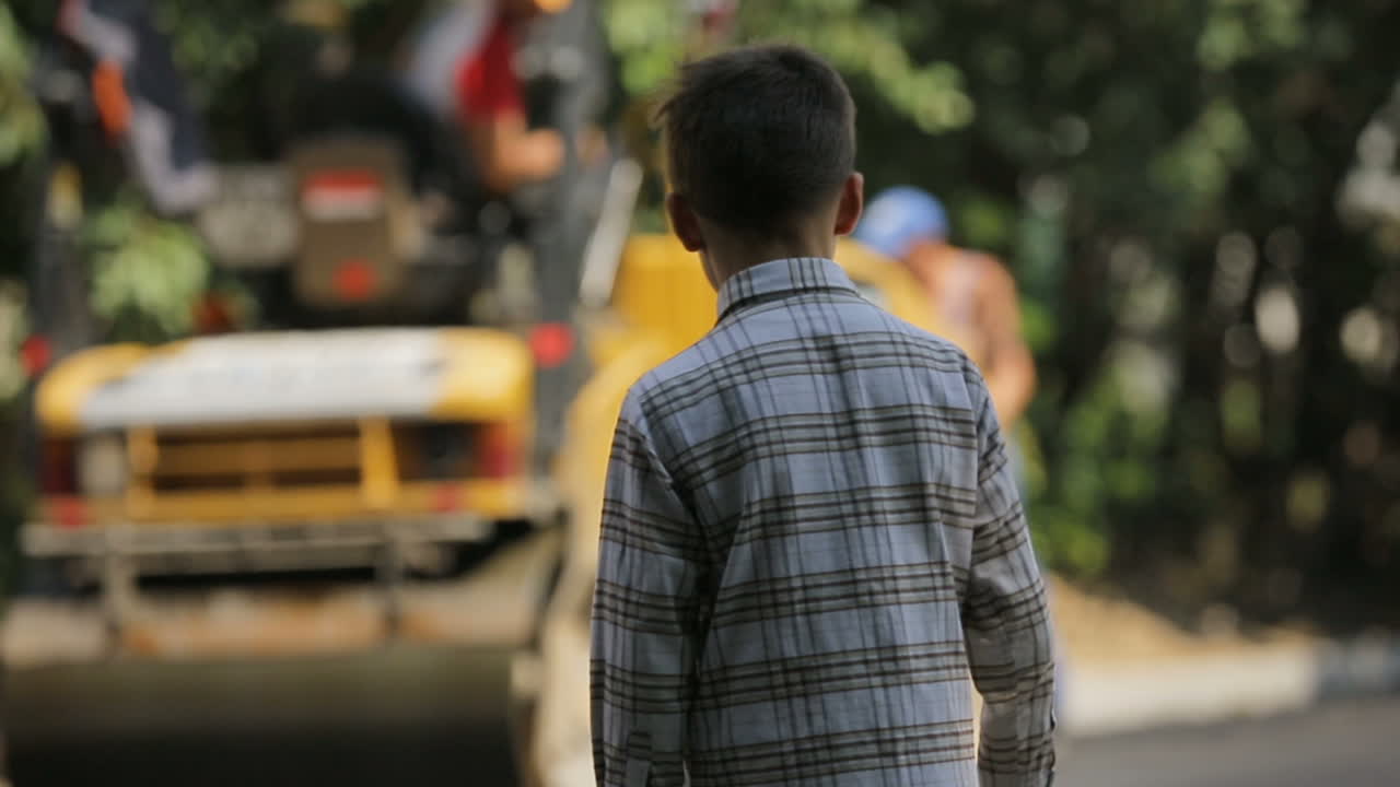 VINNITSA, UKRAINE - JULY 2017: Men working at the road construction