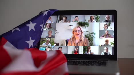 animation of american flag laptop computer in the background. american society diversity concept digital composition.