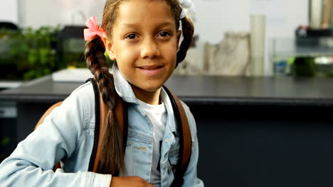 Portrait-of-happy-schoolkid-sitting-in-laboratory-4k