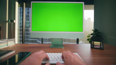 closeup unknown man typing chromakey computer. boss arms working green screen pc