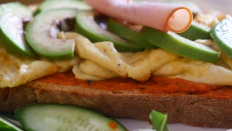 avocado and ham toast with scrambled eggs