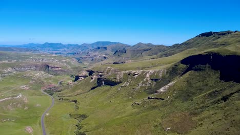 sideways aerial view of a vast national park featuring a single winding road. perfect for nature, travel, and adventure projects
