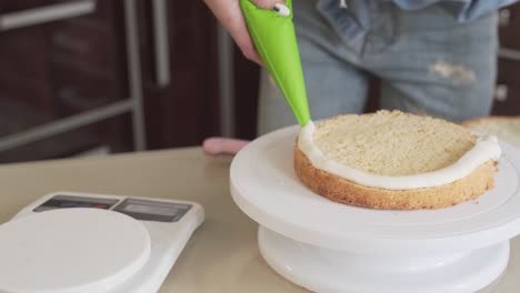 close up video of a woman making a cake