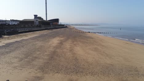 popular seaside rhyl resort town aerial pull back view above coastal beach seascape