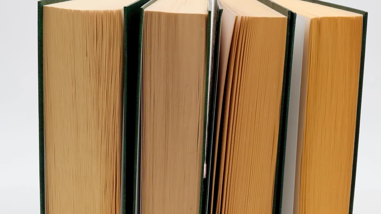 Books set in green covers on white background.Reading and education. Knowledge concept.Literature and reading concept.