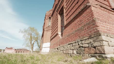 ruined brick church in rural landscape