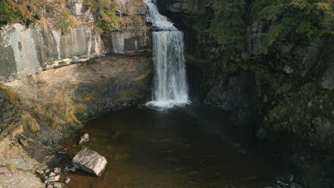 waterfall high level approach in winter sunshine at ingleton waterfalls trail yorkshire uk