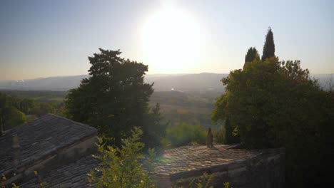 peaceful view of the countryside and the french hills from an old sunny village in slowmotion bright blue sky in drome