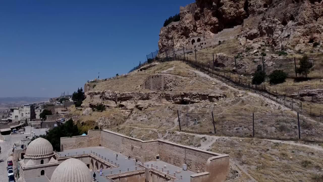 Mardin, Turkey, Cinematic Places and People Activities - Street View -  The Zinciriye Madrasa and the Castle