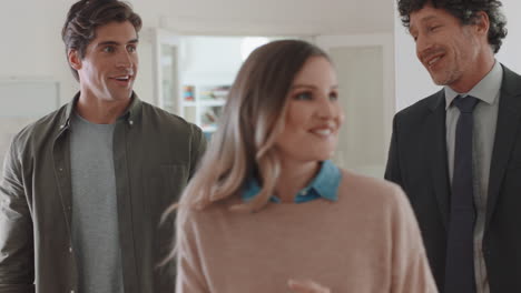 real estate agent showing young couple new house presenting property investment happy clients shaking hands with realtor successfully purchasing home 4k footage