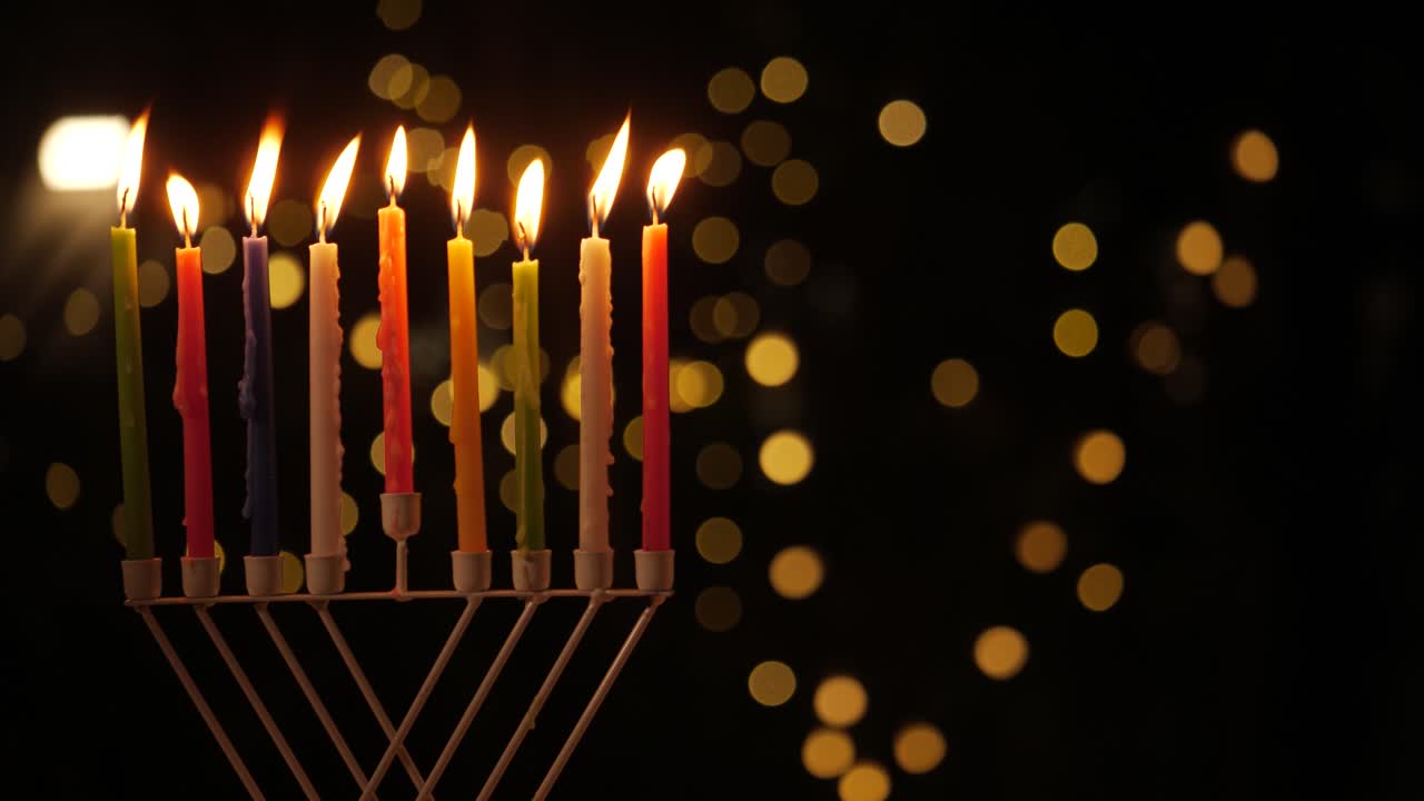 kindle the Menorah candles Hanukkah holiday at night left screen 4k