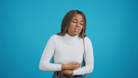 woman suffering from headache and stomach pain