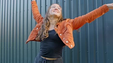 girl in vivid orange celebrates life in slow motion