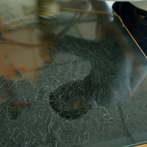 Iron filings in a magnetic field. Boy conducts research experience. Square video