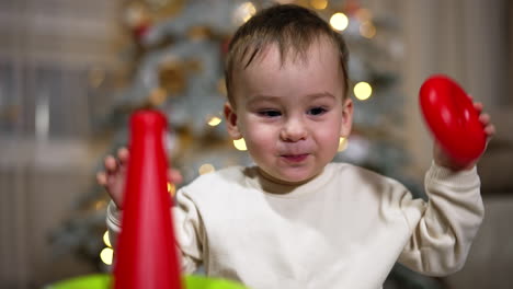 baby playing with christmas toys