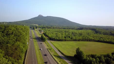 us route 52 in foreground with pilot mountain looming in background