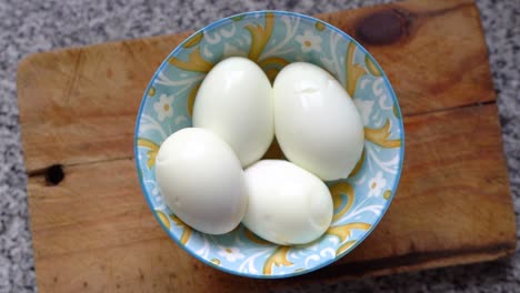 top view of whole hard-boiled eggs in a bowl in the kitchen