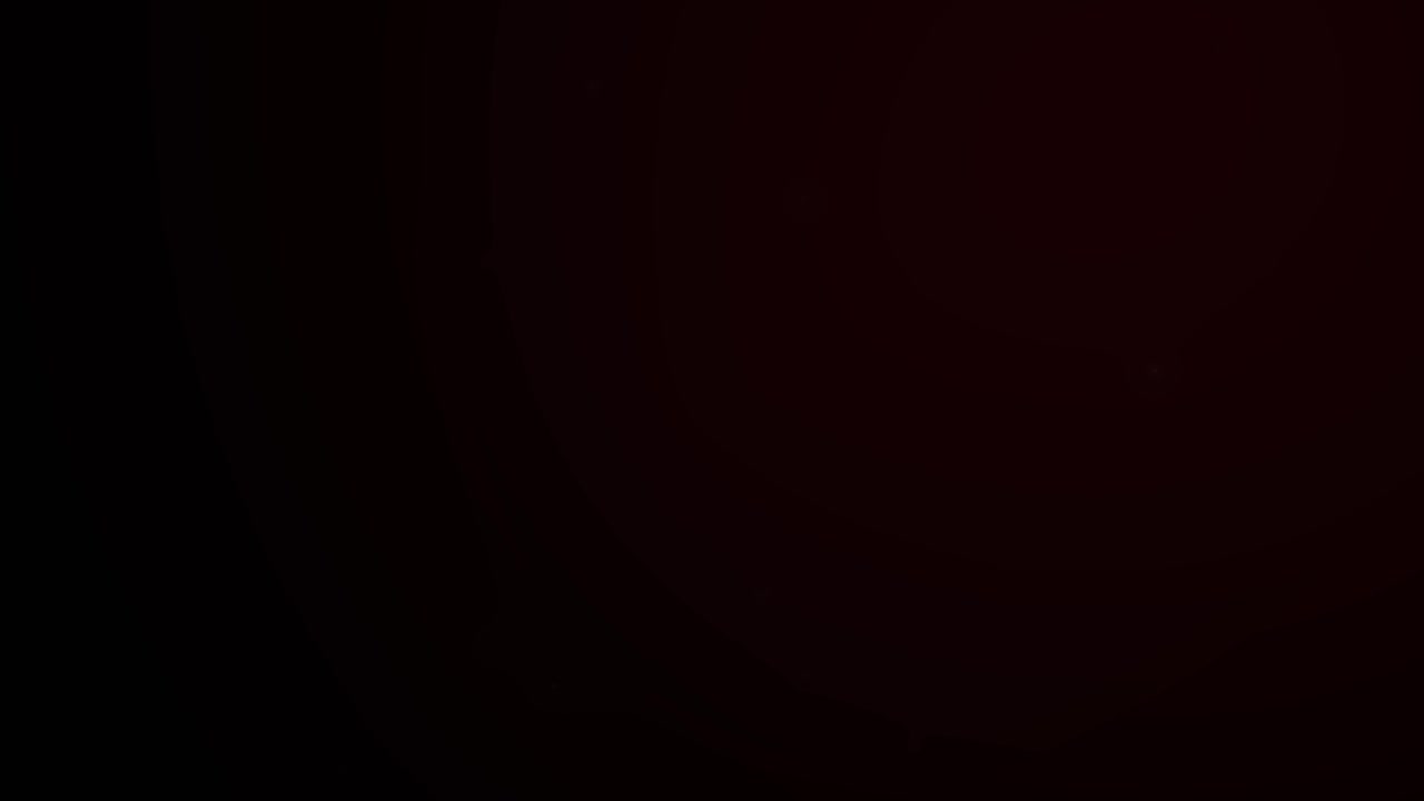 Subtle Red Light Flare on Dark Background