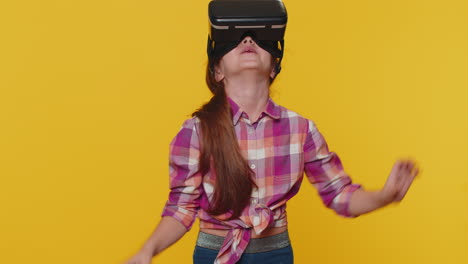 Child-girl-kid-using-virtual-reality-VR-app-headset-to-play-simulation-3D-video-game-watching-video