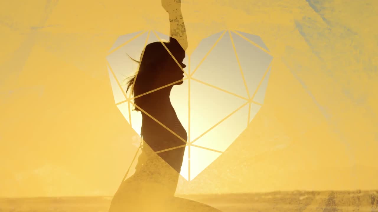 Woman holding yoga pose through yellow heart shaped foreground