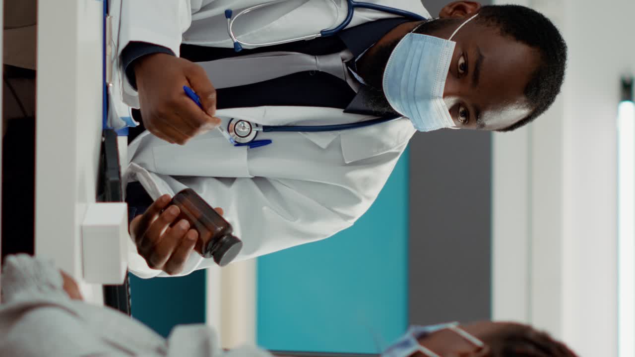 General practitioner giving bottle of pills as prescription treatment