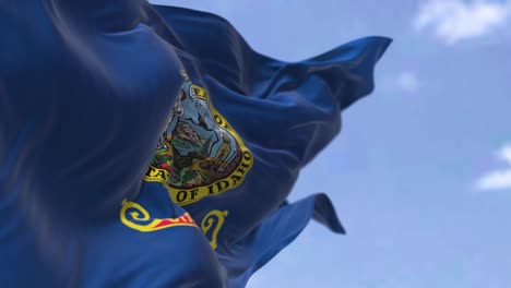 the us state flag of idaho waving in the wind