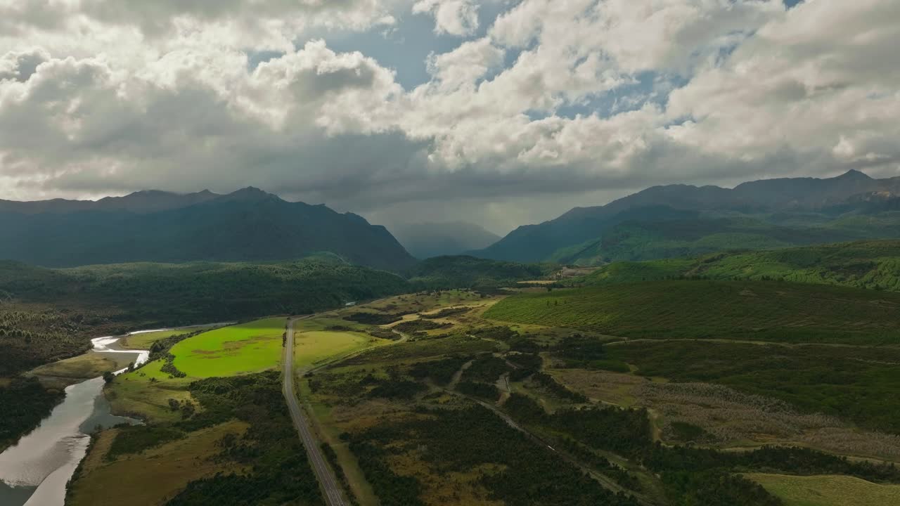 Te Anau's lush landscape under dramatic skies in Milford, New Zealand