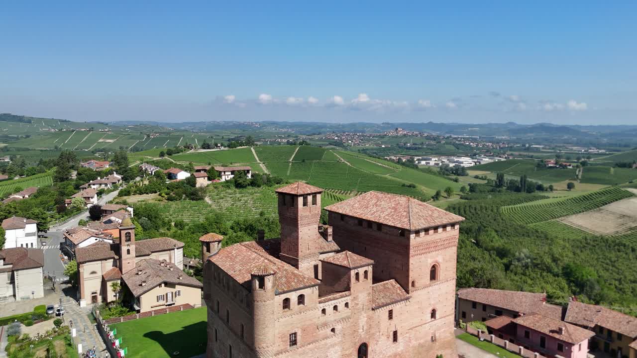 Grinzane Cavour castle, UNESCO site, Cuneo, Piedmont, Italy. 4k aerial view of the castle together with the Vineyard. Langhe-Roero and Monferrato. Spiral forward to the casle.