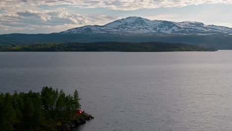 Drone shot of a lake in Sweden with Åreskutan behind.