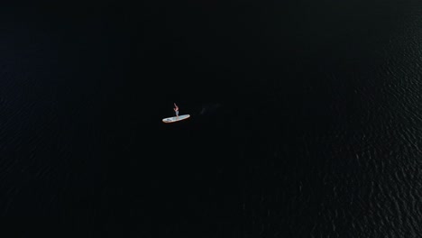 Blue-lake-tourist-on-paddle-bord-4k-drone-shot-in-New-Zealand