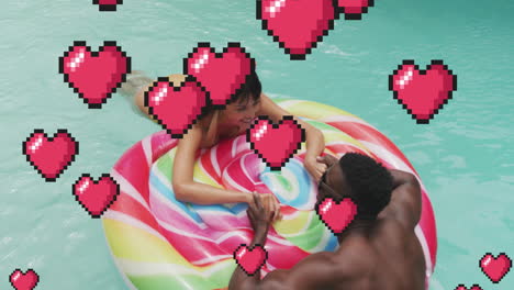 couple enjoying pool on colorful float with pixelated hearts animation overlay