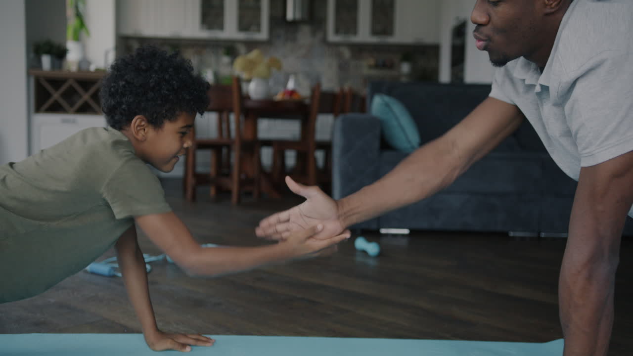 Father and Son Working Out Together at Home
